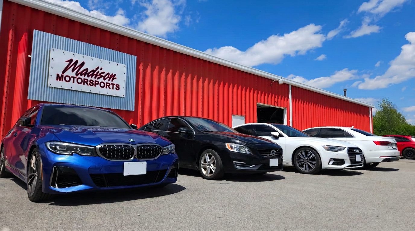 BMW, Volvo and Audi parked outside the Madison Motorsports storefront